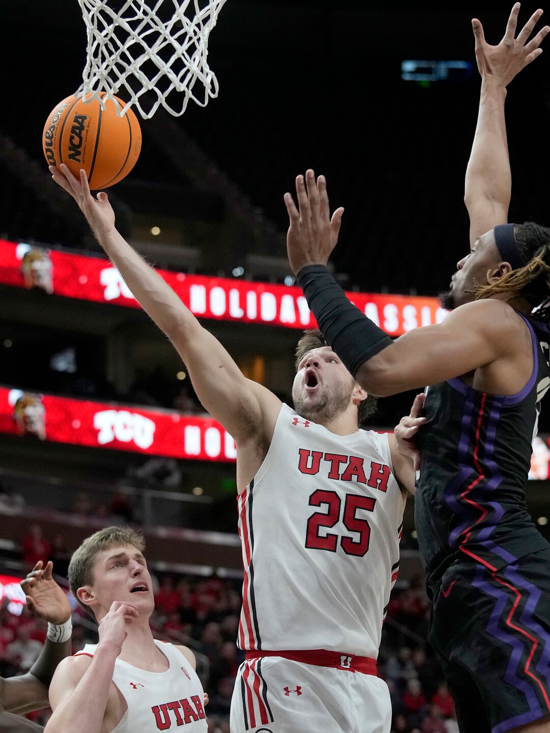 (Leah Hogsten | The Salt Lake Tribune) Utah Utes guard Rollie Worster (25) looks to the net as the University of Utah hosts the TCU Horned Frogs at Vivint Arena, Dec. 21, 2022. 