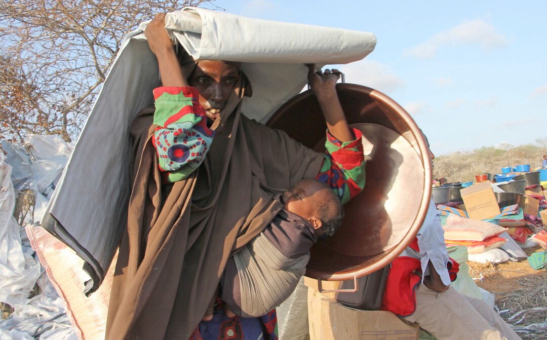 (Farah Abdi Warsameh  |  AP Photo)  A Somali woman displaced by the drought, arrives at the camp in the Kaxda area on the outskirts of Mogadishu, Somalia, Friday April 14, 2017. Somalia's current drought is threatening half of the country's population, or about 6 million people, and is joined by similar hunger crises in South Sudan, northeastern Nigeria and Yemen, which together make up what the United Nations calls the world's largest humanitarian disaster in more than 70 years.