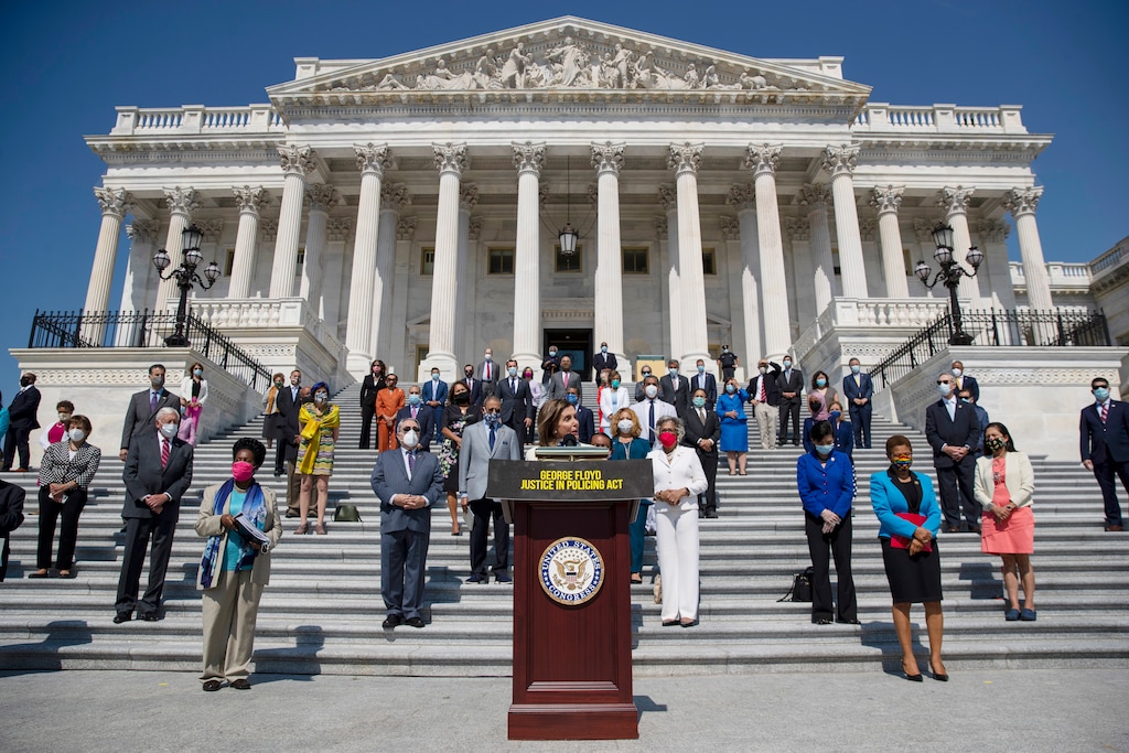 (Carolyn Kaster | The Associated Press) House Speaker Nancy Pelosi of Calif., joined by House Democrats spaced for social distancing, speaks during a news conference on the House East Front Steps on Capitol Hill in Washington, Thursday, June 25, 2020, ahead of the House vote on the George Floyd Justice in Policing Act of 2020.