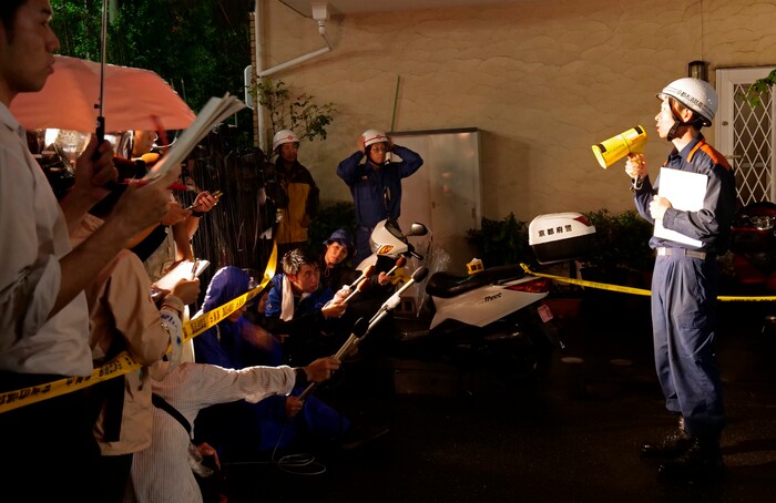 (Hiromi Tanoue | AP Photo) A firefighter speaks to the media on a fire at Kyoto Animation building in Kyoto, western Japan, Thursday, July 18, 2019. The fire broke out in the three-story building in Japan's ancient capital of Kyoto, after a suspect sprayed an unidentified liquid to accelerate the blaze, Kyoto prefectural police and fire department officials said.