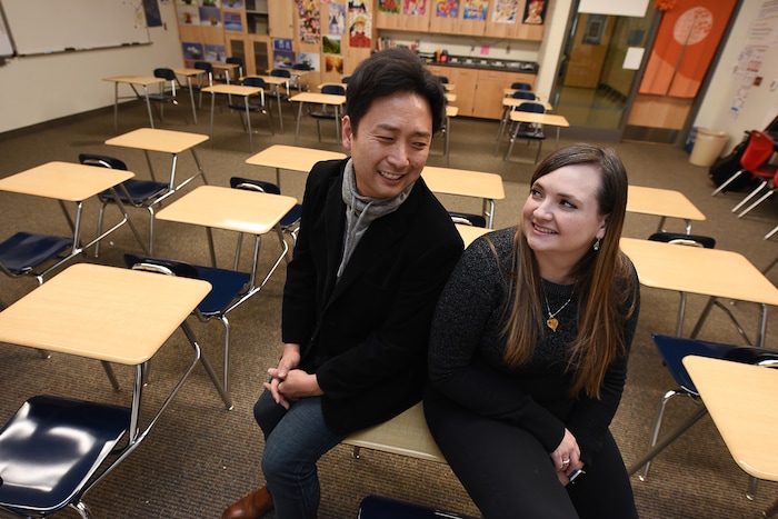 (Francisco Kjolseth  |  The Salt Lake Tribune)  Masa Fukuda, a songwriter, music arranger and director of the One Voice Children's Choir joins his wife Alyssa Fukuda in her classroom at Granger High School where she teaches Japanese. Set up by a friend in July of 2015, the two married a few months later in October. 