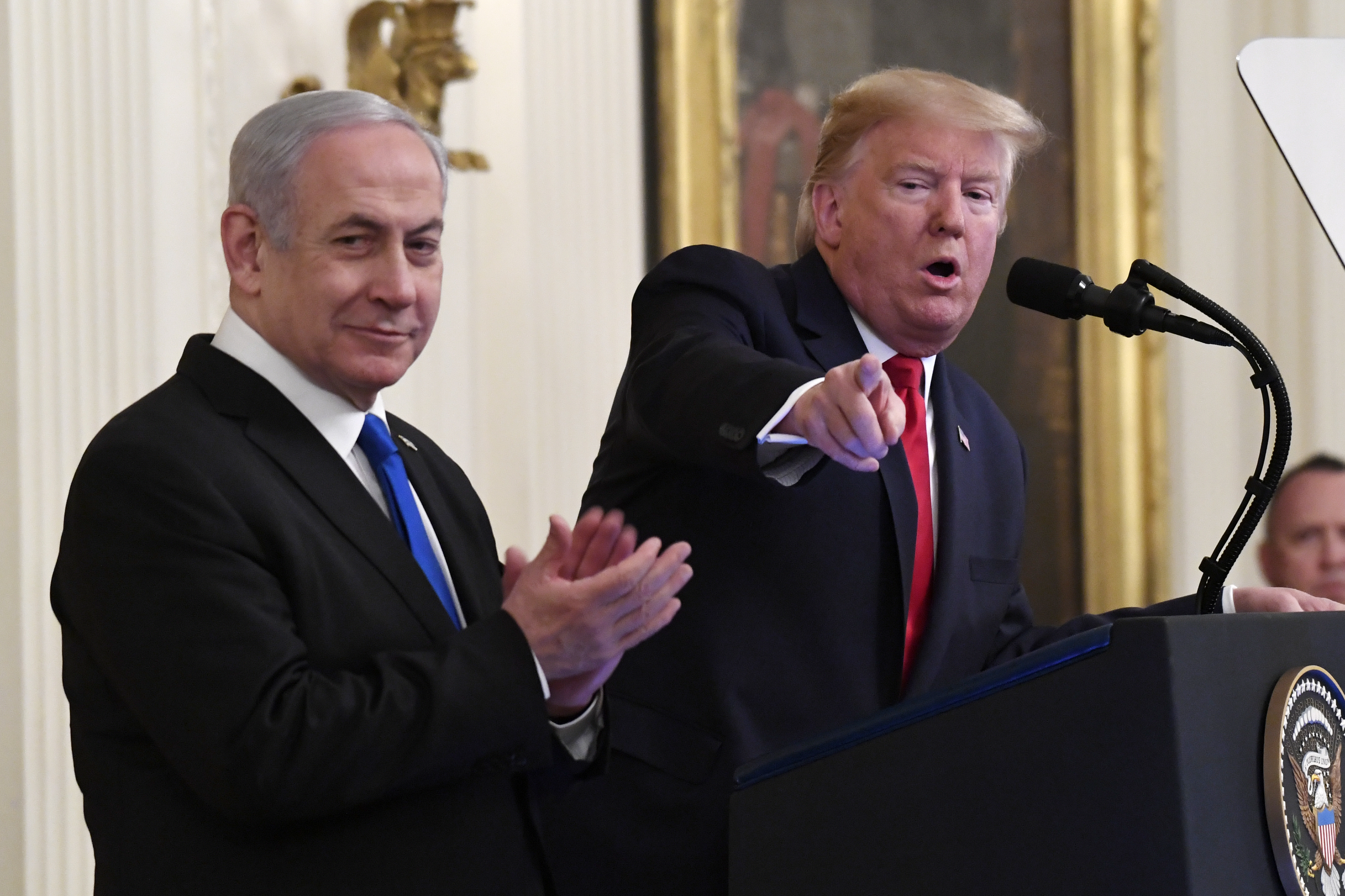 (Susan Walsh | AP) President Donald Trump speaks during an event with Israeli Prime Minister Benjamin Netanyahu in the East Room of the White House in Washington, Tuesday, Jan. 28, 2020.