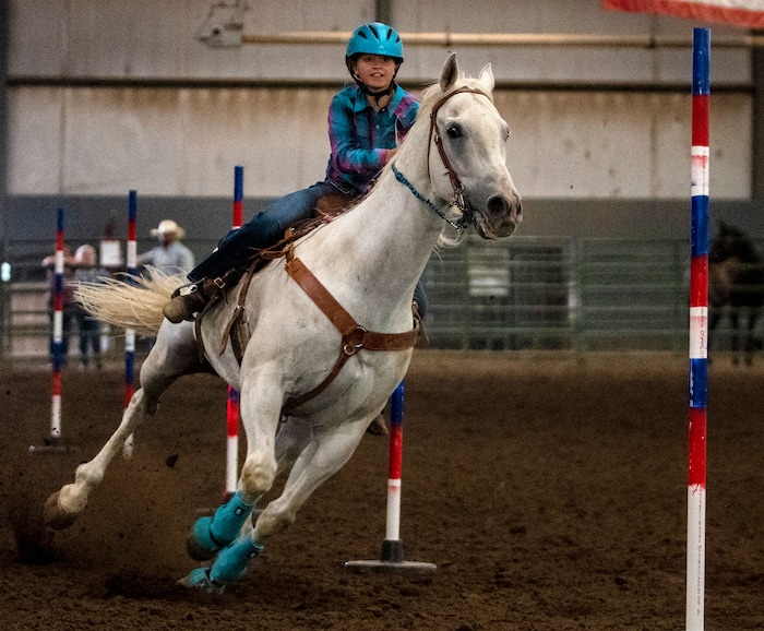 (Rick Egan | The Salt Lake Tribune) Alexa Marshall competes in the pole bending completion at the Panguitch Invitation Rodeo on Saturday, July 23, 2022.