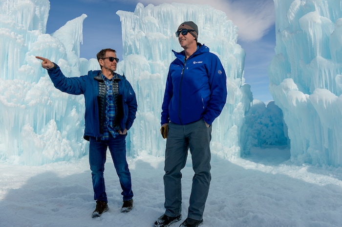 Leah Hogsten | The Salt Lake Tribune l-r Founder, Brent Christensen and CEO Ryan Davis survey the installation, Friday, Jan. 4, 2019. The idea started with a backyard castle in Alpine followed by an ice castle in downtown Midway in 2009. Ice Castles is open for the winter Saturday, Jan. 5, at Homestead Resort. This is the ninth season the popular frozen art installation is drawing visitors to walk around the giant LED-lit icicle formations.