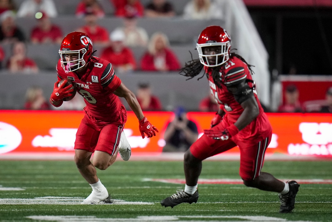 (Bethany Baker  |  The Salt Lake Tribune) Utah Utes wide receiver Mana Carvalho (8) runs the ball as safety Nate Tilmon (21) looks to block during the first half of the game between the Utah Utes and the Idaho Vandals at Rice-Eccles Stadium in Salt Lake City on Thursday, Sept. 3, 2026.