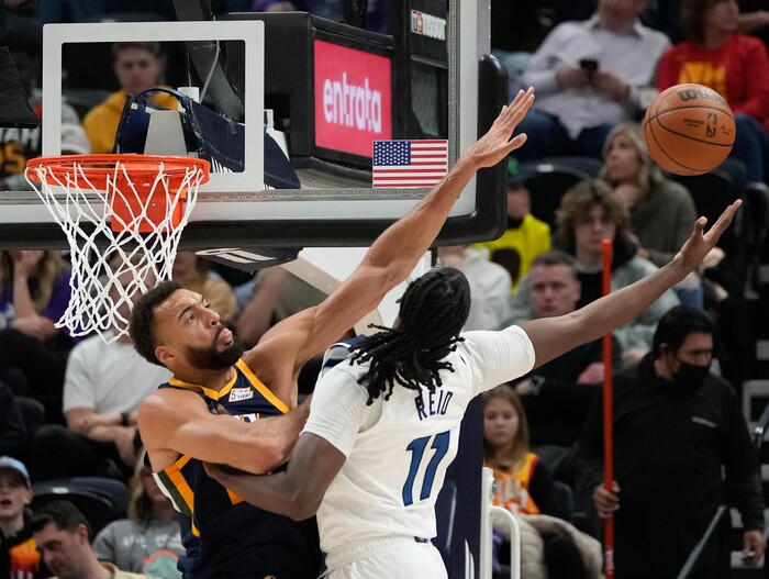 (Francisco Kjolseth | The Salt Lake Tribune) Utah Jazz center Rudy Gobert (27) blocks Minnesota Timberwolves center Naz Reid (11) in NBA action between the Utah Jazz and the Minnesota Timberwolves at Vivint Smart Home Arena in Salt Lake City, Thursday, Dec. 23, 2021.