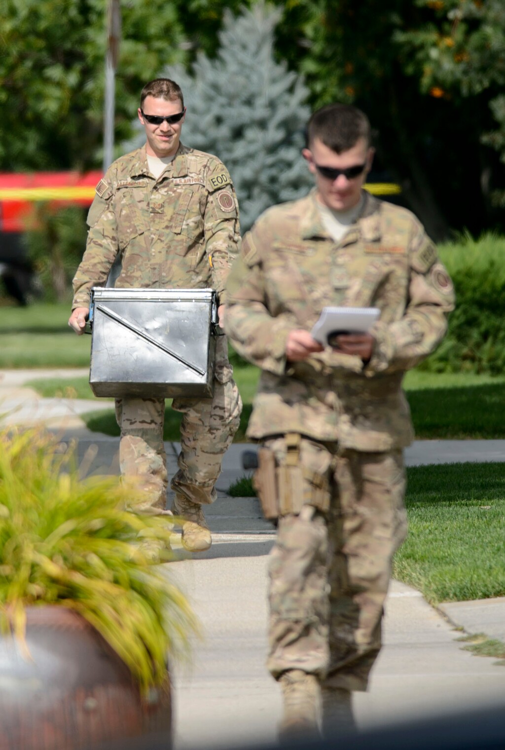 (Steve Griffin  |  The Salt Lake Tribune) U.S. Air Force personnel remove a World War II era Japanese Type 89 shell from a home in Cottonwood Heights Monday August 7, 2017. The shell was discovered by a man who was cleaning out the home of a friend who had recently passed away. The Air Force placed the shell in a large metal canister and removed it from the home. According to Cottonwood Heights police the shell was in pristine condition when it was found.