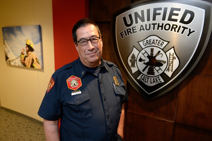 (Francisco Kjolseth  |  The Salt Lake Tribune)  Fitzgerald Petersen, a captain with Unified Fire Authority often has a front row seat to documenting his colleagues on the fire line. At UFA headquarters in Salt Lake many of his photographs are on display. For the past 17 years he's been the department's photographer. In that capacity, he listens to his radio on his off days and responds to incidents to document his coworkers.