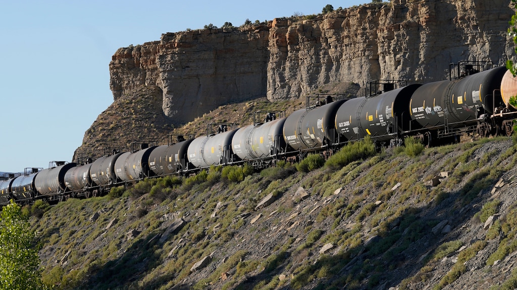 (Rick Bowmer | Associated Press) A train transports freight on a common carrier line near Price, Utah on Thursday, July 13, 2023. Uinta Basin Railway, which would connect to common carrier lines, could be an 88-mile line in Utah that would run through tribal lands and national forest to move oil and gas to the national rail network. Critics question investing billions in oil and gas infrastructure as the country seeks to use less of the fossil fuels that worsen climate change.