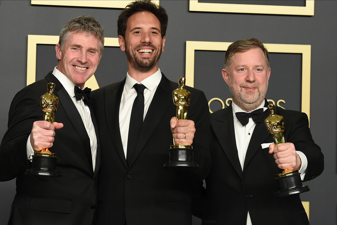 (Jordan Strauss | Invision/AP)  Dominic Tuohy, from left, Guillaume Rocheron, and Greg Butler, winners of the award for best visual effects for "1917", pose in the press room at the Oscars on Sunday, Feb. 9, 2020, at the Dolby Theatre in Los Angeles.
