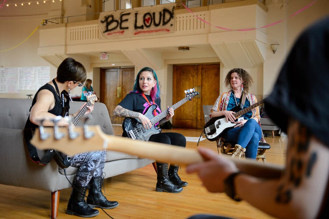 (Trent Nelson | The Salt Lake Tribune)  Brew Lira teaches the bass at Rock Camp for Womyn. Those attending the camp in February learned how to play instruments, form bands, write songs, and perform live in concert — all in three days.
