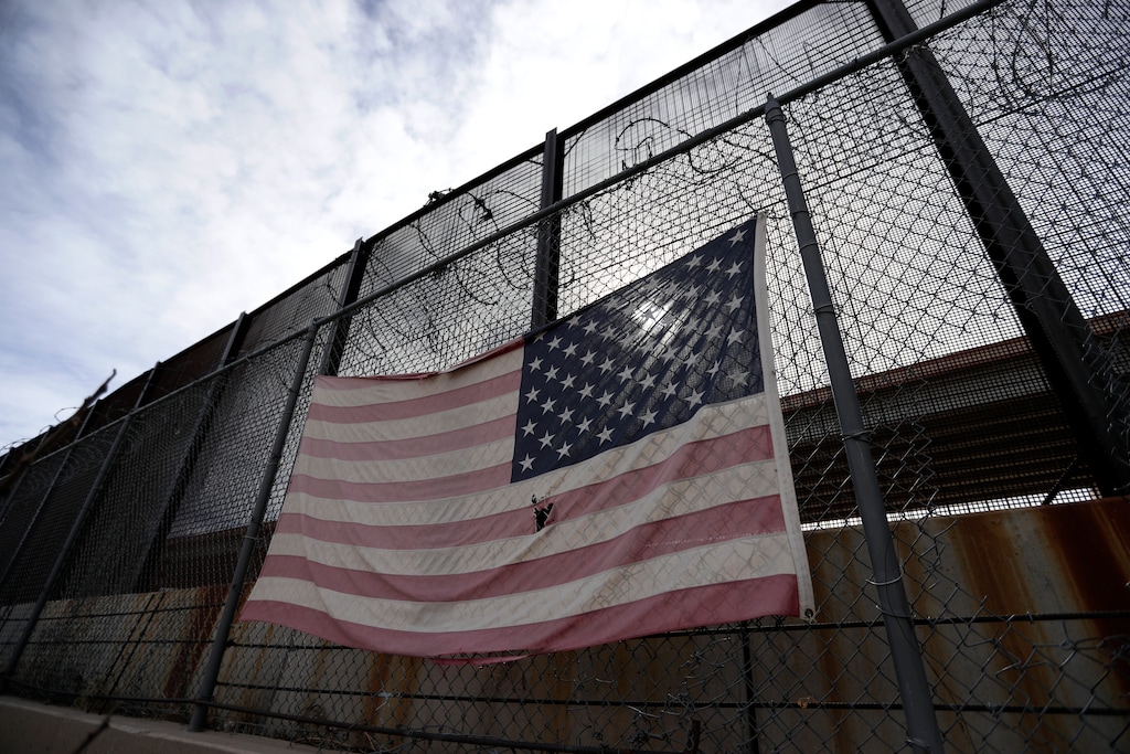 (Eric Gay | AP file photo)  In this Monday, Jan. 21, 2019, photo, a U.S. flag hangs on a border barrier in El Paso, Texas.