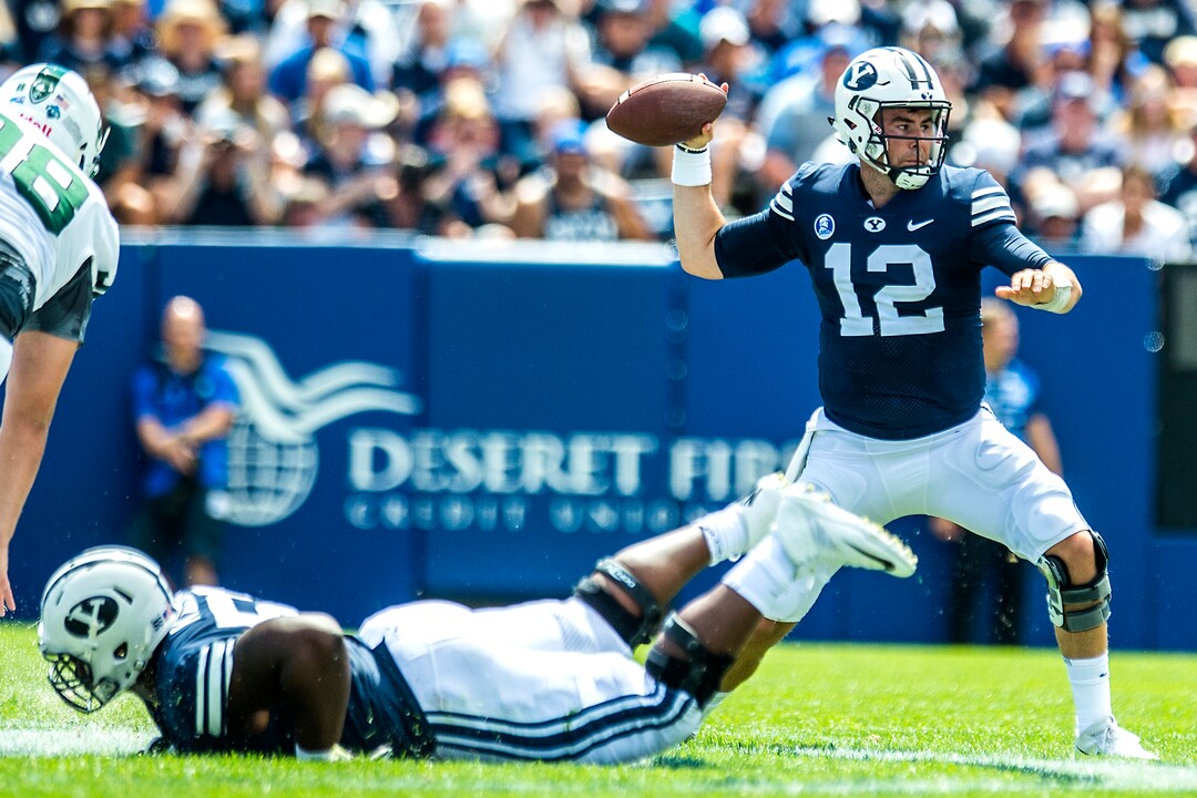 (Chris Detrick  |  The Salt Lake Tribune)  Brigham Young Cougars quarterback Tanner Mangum (12) throws the ball during the game at LaVell Edwards Stadium Saturday, August 26, 2017.