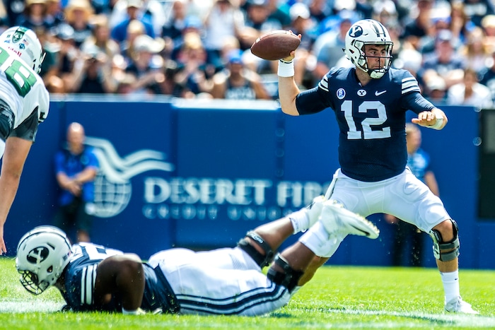 (Chris Detrick  |  The Salt Lake Tribune)  Brigham Young Cougars quarterback Tanner Mangum (12) throws the ball during the game at LaVell Edwards Stadium Saturday, August 26, 2017.
