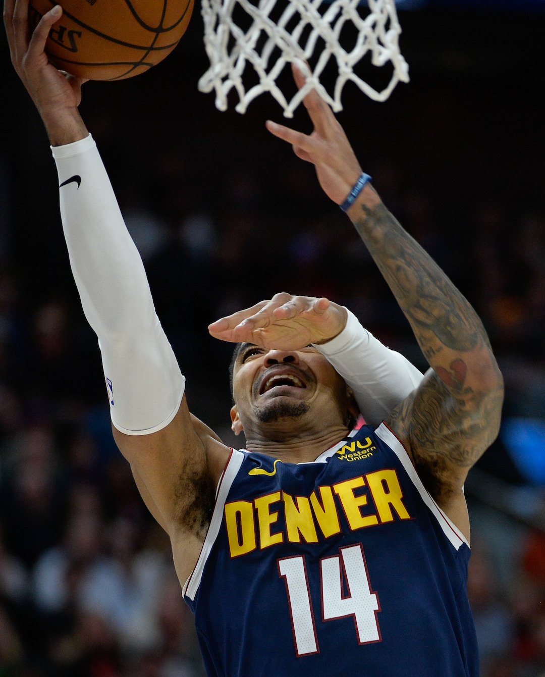 (Francisco Kjolseth  |  The Salt Lake Tribune) aUtah Jazz guard Donovan Mitchell (45) gets one hand in on Denver Nuggets guard Gary Harris (14) the Utah Jazz host the Denver Nuggets in their NBA basketball game at Vivint Smart Home Arena in Salt Lake City on Wednesday, Feb. 5, 2020.