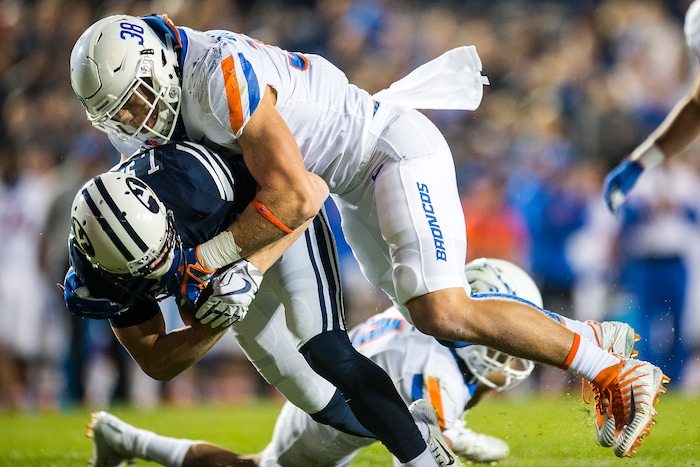 (Chris Detrick  |  The Salt Lake Tribune)  Boise State Broncos linebacker Leighton Vander Esch (38) tackles Brigham Young Cougars wide receiver Talon Shumway (21) during the game LaVell Edwards Stadium Friday, October 6, 2017. 