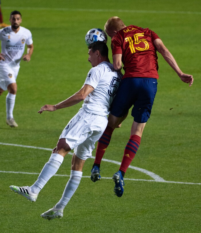 (Francisco Kjolseth  |  The Salt Lake Tribune) Los Angeles Galaxy defender Daniel Steres (5) goes for a header alongside Real Salt Lake defender Justen Glad (15) as Real Salt Lake hosts L.A. Galaxy at Rio Tinto Stadium in Sandy on Wednesday, Sept. 23, 2020.