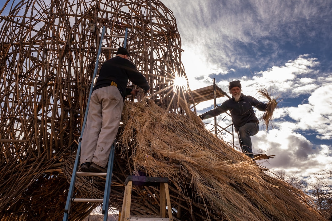 (Photo courtesy of John Gregor | Cold Snap Photography) Artist Joe Pachak's at work on his winter solstice sculpture in 2019.