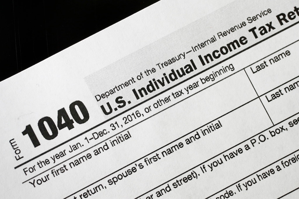 (Mark Lennihan | AP file photo)  A 1040 tax form appears on display, Tuesday, Jan. 10, 2017, in New York.