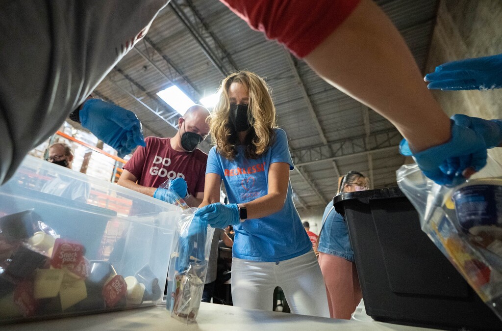 (Francisco Kjolseth | The Salt Lake Tribune) Gov. Spencer Cox and First Lady Abby Cox participate in a service project at the Granite Education Foundation Donation & Distribution Center as part of the national "9/11 Day of Service” campaign on Saturday, Sept. 11, 2021. Service is one of the first lady’s four focus areas under the Show Up initiative, to honor the memory of the heroes of Sept. 11, 2001.