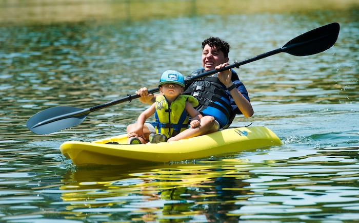 (Rick Egan  |  The Salt Lake Tribune)    Isaac Deleon paddles as Leo Gines, 2,  enjoys the ride, as they float on Farmington Pond in a kayak, Thursday, July 26, 2018.