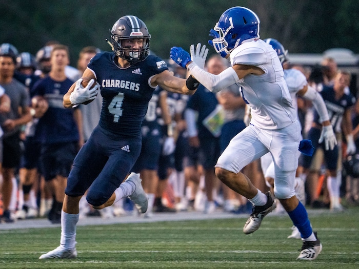 (Rick Egan | The Salt Lake Tribune) Corner Canyon wide receiver Blaze DeGracie (4) runs for extra yards for the Chargers, in prep football action between the Corner Canyon Chargers and the Bingham Miners, on Friday, Aug. 27, 2021.