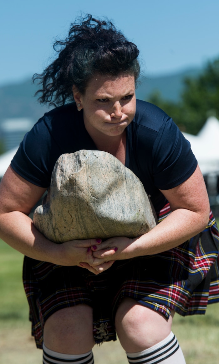 (Rick Egan  |  The Salt Lake Tribune)      Aubri Fulton competes in the Stone Lifting competition, at the 44th annual Utah Scottish Festival and Highland Games at the Utah State Fairgrounds, Sunday, June 10, 2018.