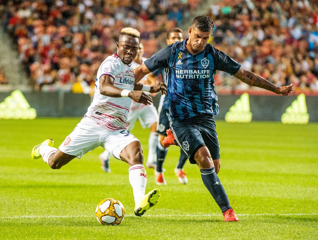 (Rick Egan  |  The Salt Lake Tribune)  Real Salt Lake forward Sam Johnson (50) brings the ball down field as Los Angeles Galaxy defender Diego Polenta (3) defends, in MLS soccer action between Real Salt Lake and Los Angeles Galaxy at Rio Tinto Stadium, Wednesday, Sept. 25, 2019.