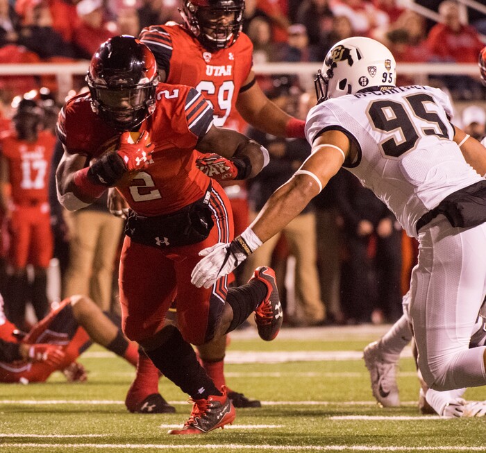 (Rick Egan  |  The Salt Lake Tribune)  Utah Utes running back Zack Moss (2) gets past Colorado Buffaloes defensive back Ryan Moeller (25) for a touchdown, in PAC-12 football action Utah Utes vs. Colorado Buffaloes at Rice-Eccles stadium, Saturday, November 25, 2017.


