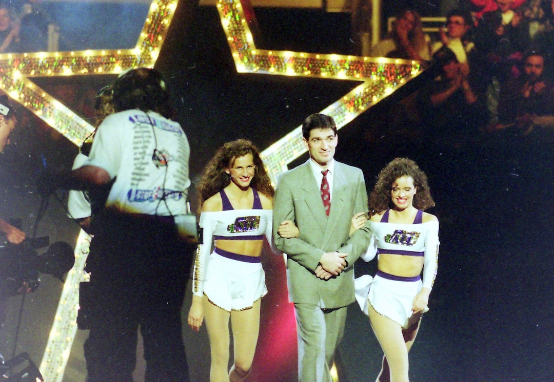 (Steve Griffin  | Tribune File Photo) John Stockton is escorted onto the court by two Jazz dancers during the 1993 All-Star festivities in the Delta Center in Salt Lake City, Saturday, Feb. 20, 1993.