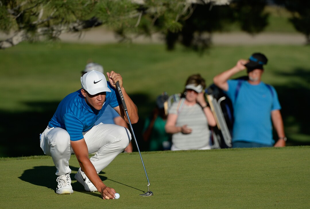 (Francisco Kjolseth  |  The Salt Lake Tribune)  Cameron Champ from Sacramento, CA, places his ball on the final hole of the Utah Championship golf event on the Web.com Tour at Oakridge Country Club in Farmington on Sunday, July 15, 2018, on his way to winning the championship. 