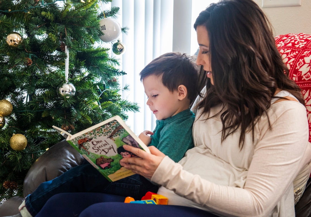 (Rick Egan  |  The Salt Lake Tribune)   Janelle Funicello Porter reads to her son  Bridger at her home in Draper. A new study from the U, showing a link between miscarriages and air pollution. Janelle is 20 weeks pregnant and is concerned about air pollution. Friday, Dec. 14, 2018.