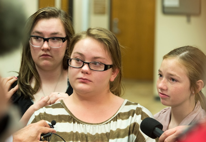 (Rick Egan  |  The Salt Lake Tribune)        Breezy Otteson's sister, Kylysta Otteson listens as  NIkka Powell, Riley's sister, (center) talks to the media, as Maddison Otteson, Breezy's sister, listens in, after Jerrod Baum appeared for a hearing in Provo. Baum is accused of killing 18-year-old Riley Powell and 17-year-old Brelynne “Breezy” Otteson in December and dumping their bodies into an abandoned mine shaft. Thursday, April 26, 2018.   


