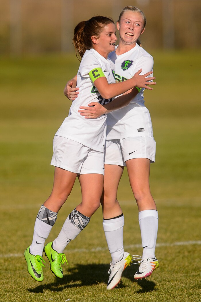 (Trent Nelson | The Salt Lake Tribune)  Syracuse's Caroline Stringfellow (35) celebrates a goal with teammate Ashlyn Hall in the Class 6A girls' soccer state quarterfinal between Pleasant Grove and Syracuse, in Syracuse Thursday October 12, 2017.