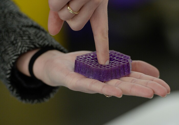(Francisco Kjolseth | The Salt Lake Tribune)  Savannah Turk uses a sample "squishy" to demonstrate how pressure points push down on the hyperlastic polymer while maintaining overall support on the mattresses made by Purple, an Alpine based company that has developed tech to manufacture flexible mattresses at a plant in Grantsville.