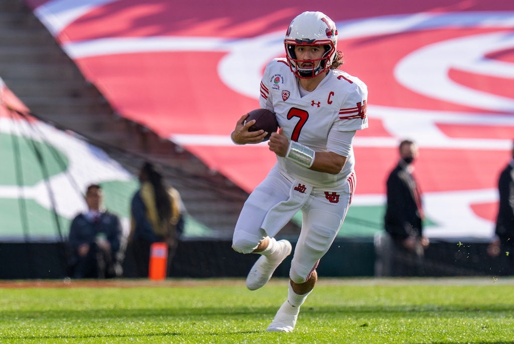(Rick Egan | The Salt Lake Tribune) Utah Utes quarterback Cameron Rising (7), runs for a first down on a quarterback keeper against the Ohio State Buckeyes in the Rose Bowl in Pasadena, Calif., on Saturday, Jan. 1, 2022.