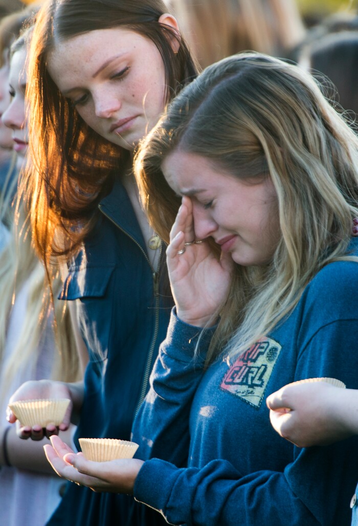 (Rick Egan  |  The Salt Lake Tribune)  Southern Utah University student Taylor Heath (left) comforts Hayley Goen (right) during a candle light vigil for the victims of the Las Vegas shooting, on the SUU campus in Cedar City, Wednesday, October 4, 2017.