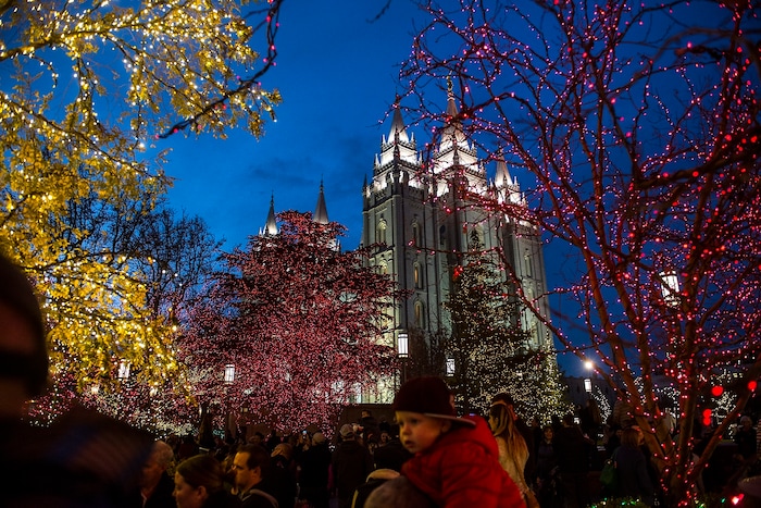(Chris Detrick  |  The Salt Lake Tribune)  Visitors look at Christmas Lights on Temple Square Friday, November 24, 2017.  The first year the light were put up on Temple Square was in 1965. The lights will run through the end of the year. 