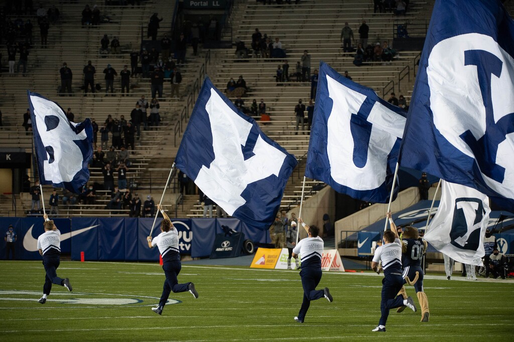 (Francisco Kjolseth  |  The Salt Lake Tribune) The BYU cheer team takes to the field before the game against Texas State during an NCAA college football game at LavVell Edwards Stadium, Saturday, oct. 24, 2020, in Provo, Utah.
