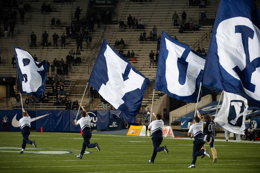 (Francisco Kjolseth  |  The Salt Lake Tribune) The BYU cheer team takes to the field before the game against Texas State during an NCAA college football game at LavVell Edwards Stadium, Saturday, oct. 24, 2020, in Provo, Utah.