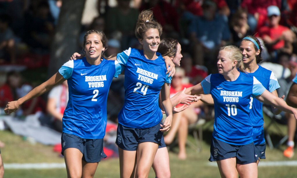 (Rick Egan  |  Tribune File Photo) Taylor Campbell Isom (2) Stephanie Ringwood Ney, (24) midfielder Bizzy Bowen (10), celebrate Isom's goal during a 2016 match. Cougar alums are celebrating again as BYU prepares to play in the College Cup, the sport's final four, for the first time.