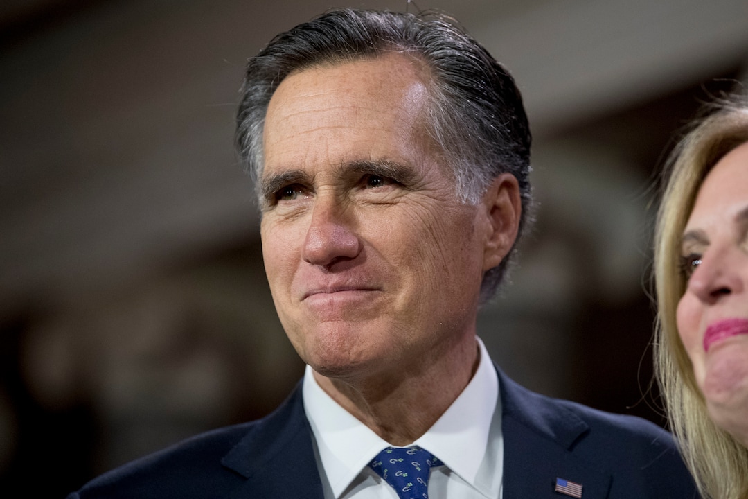 Sen. Mitt Romney, R-Utah, smiles during a mock swearing in ceremony in the Old Senate Chamber on Capitol Hill in Washington, Thursday, Jan. 3, 2019, as the 116th Congress begins. (AP Photo/Andrew Harnik)
