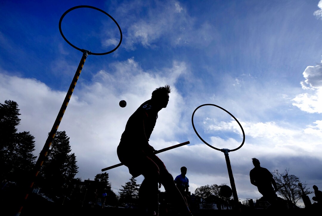 (Francisco Kjolseth | The Salt Lake Tribune) A quaffle (volleyball) sails through the air hoping to make its target, one of three rings, as Quidditch players run through drills while keeping a broom stick between their legs at all times at Reservoir Park in Salt Lake City on Wednesday, April 14, 2022. 