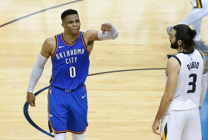 Oklahoma City Thunder guard Russell Westbrook (0) gestures to fans, in front of Utah Jazz guard Ricky Rubio (3) during the second half of Game 5 of an NBA basketball first-round playoff series in Oklahoma City, Wednesday, April 25, 2018. (AP Photo/Sue Ogrocki)