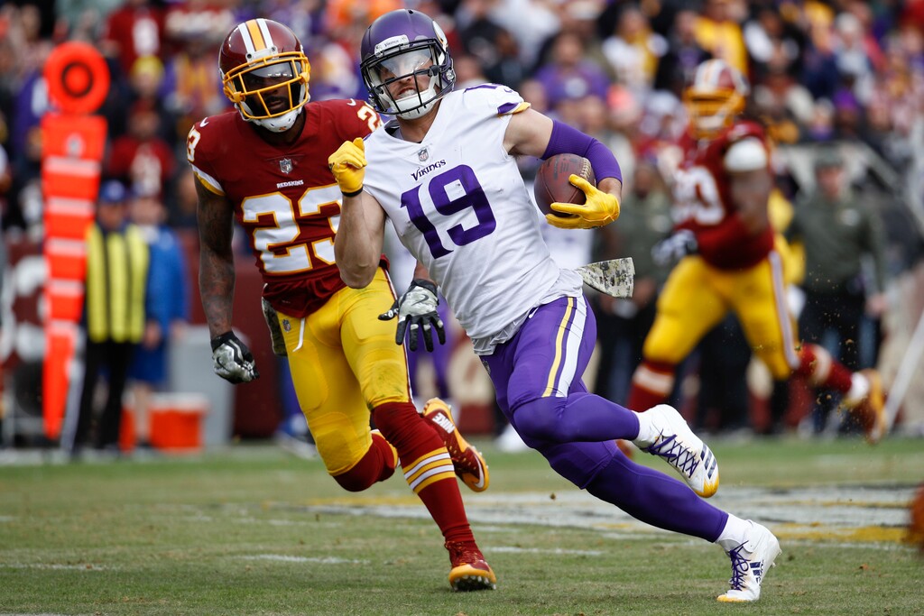 Minnesota Vikings wide receiver Adam Thielen (19) carries the ball past Washington free safety DeAngelo Hall (23) during the first half of an NFL football game in Landover, Md., Sunday, Nov. 12, 2017. (AP Photo/Patrick Semansky)
