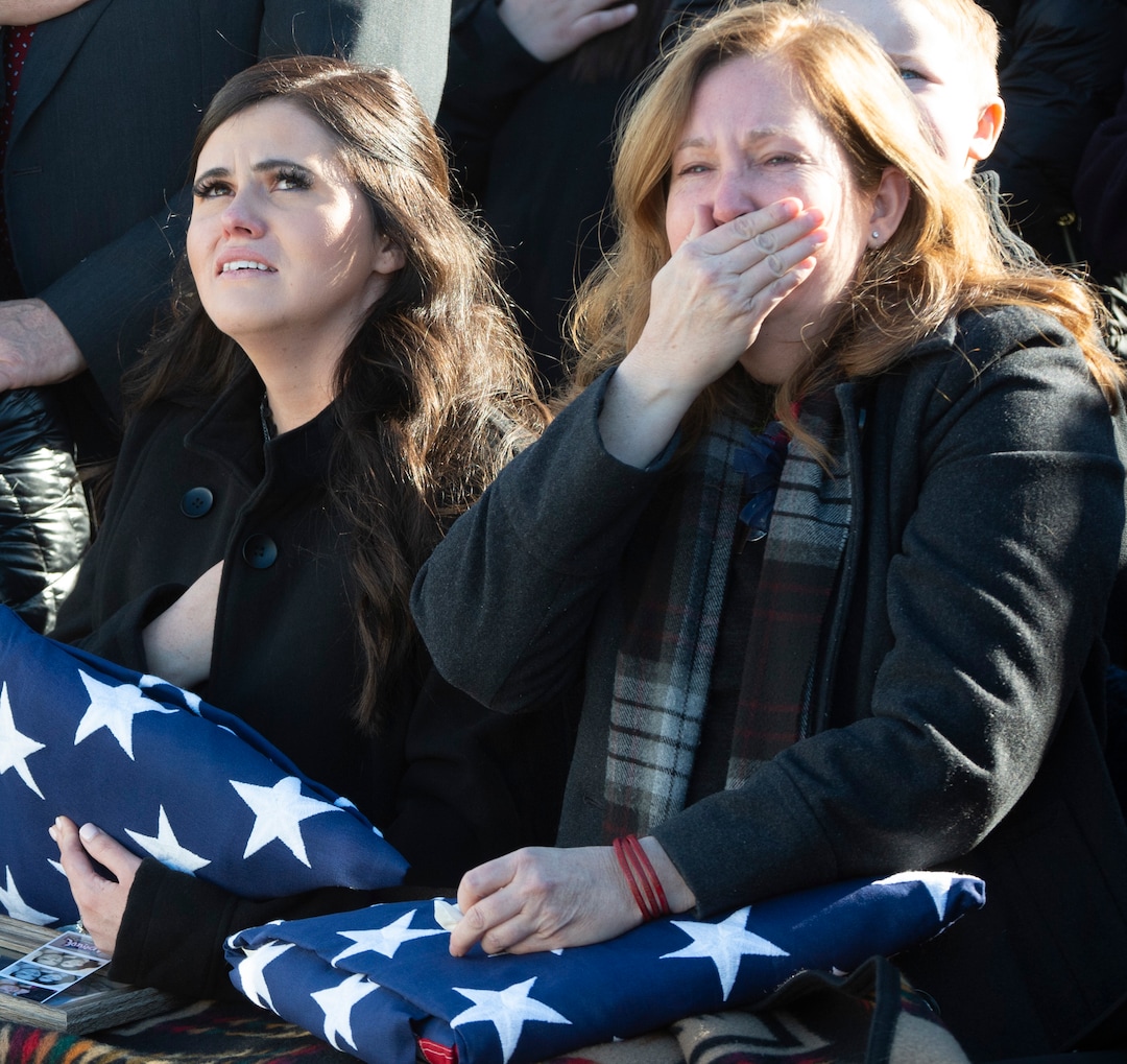 (Rick Egan  |  The Salt Lake Tribune)   McKenzie Fuchigami, (left) holds the flag from her husbands casket along with Lisa Marie Casey, Kirk's mother, during the military fly-over, in the Brigham City Cemetery, during the the graveside service for her husband Kirk T. Fuchigami Jr. who was killed in Afghanistan.  Monday, Dec. 9, 2019.