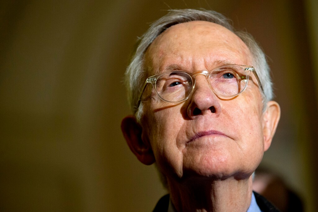 FILE - In this Tuesday, Oct. 6, 2015 file photo Senate Minority Leader Harry Reid of Nev. listens during a news conference on Capitol Hill in Washington. Reid is suing a company that makes and markets a flexible exercise band that he says slipped from his hand, causing him to fall and suffer eye, face and rib injuries on New Years Day. The lawsuit filed Tuesday in Nevada seeks more than $50,000 in damages for Reid and his wife, Landra Gould, from Thera-Band maker Hygenic Intangible Property Holding Company and related companies. (AP Photo/Jacquelyn Martin,File)