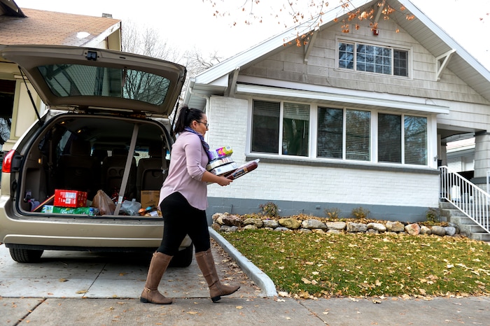 ( Leah Hogsten  |  The Salt Lake Tribune )  "This place really saved my life," said Elizabeth Winfrey, 22, who lived at the VOA home for women ages 16-20 when she was 18 years old, after leaving her mother, who had a drug problem. Now Winfrey says she's a positive role model in the girls' lives, serving as a youth advocate while attending college and working a full-time job. The Volunteers of America Utah operates two homes in Salt Lake City to homeless young adults, many of whom were turned away by their families or aged out of foster care. Staff members help the women and men finish their education, find jobs and learn life skills so they can transition to independent living or reunify with family members.