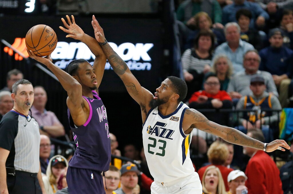 (Rick Bowmer  |  AP Photo)  Utah Jazz forward Royce O'Neale (23) defends against Minnesota Timberwolves forward Andrew Wiggins during the second half during an NBA basketball game Thursday, March 14, 2019, in Salt Lake City.