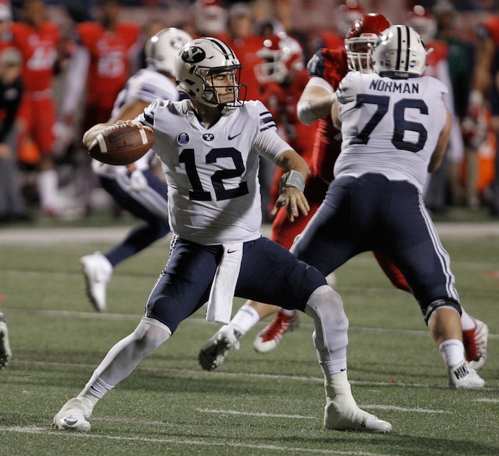 BYU's quarterback Tanner Mangum drops back to pass against Fresno State during the second half of an NCAA college football game in Fresno, Calif., Saturday, Nov. 4, 2017. Fresno State won the game 20-13. (AP Photo/Gary Kazanjian)